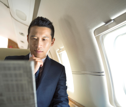 man reading on plane